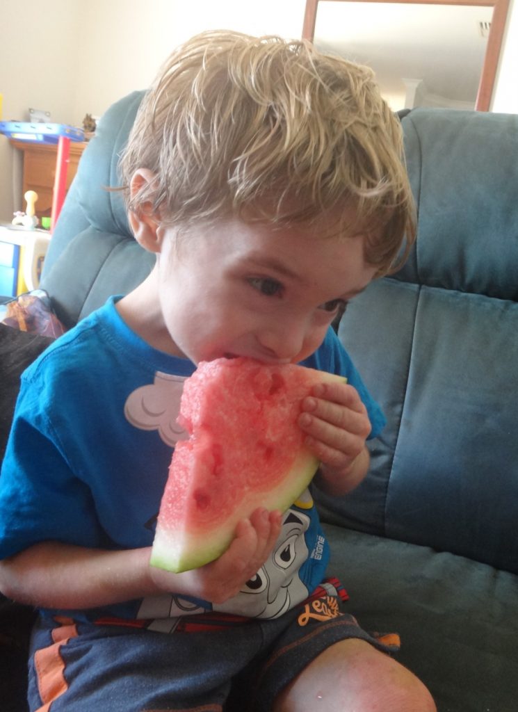 https://www.writteninwaikiki.com/when-your-child-is-a-fussy-eater/ child eating watermelon fruit