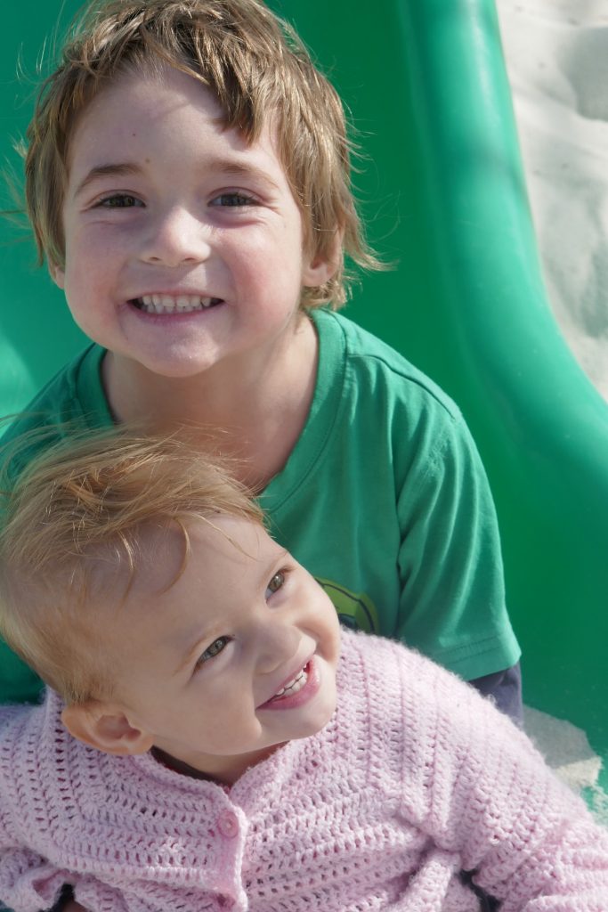 siblings brother and sister hugs and smiles