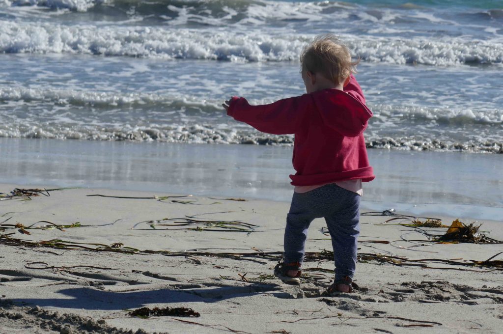 https://www.writteninwaikiki.com/the-art-of-saying-no/ child walking beach ocean