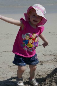  https://www.writteninwaikiki.com/things-i-want-my-daughter-to-know/ daughter girl child toddler smiling beach