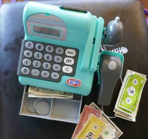 https://www.writteninwaikiki.com teach your child the value of money kids toy play money and cash register
