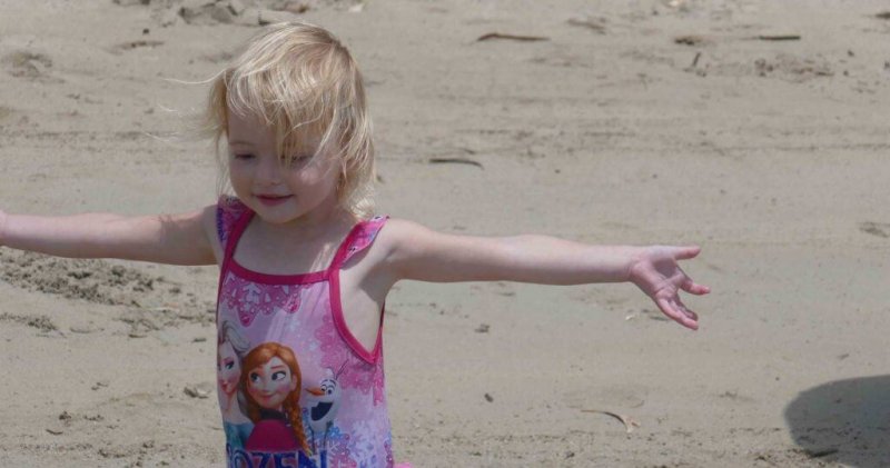 girl happy at beach