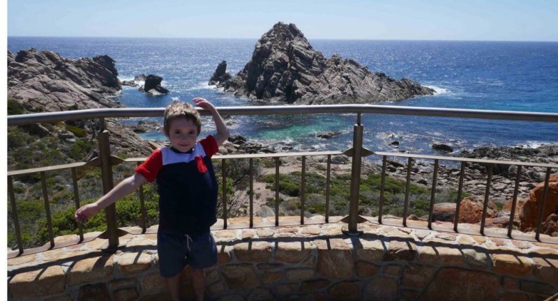 child standing at Sugarloaf Rock Yallingup Western Australia