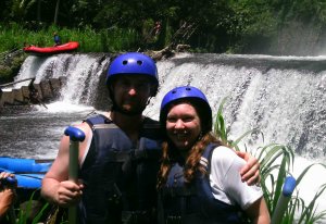 waterfall couple after white water rafting