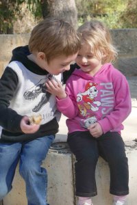 kids siblings hugging taking a moment