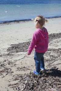 girl looking over the ocean. Be the person you want to be