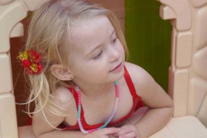 why being bored is good for kids. girl in a cubby house